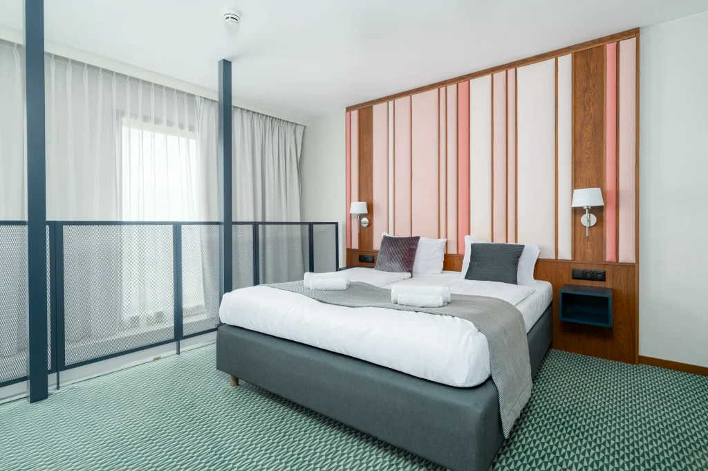 Bed on the mezzanine behind a balustrade