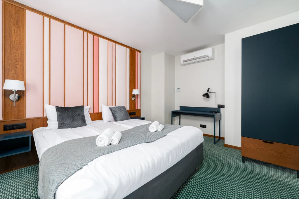 Mezzanine bedroom with a double bed and desk