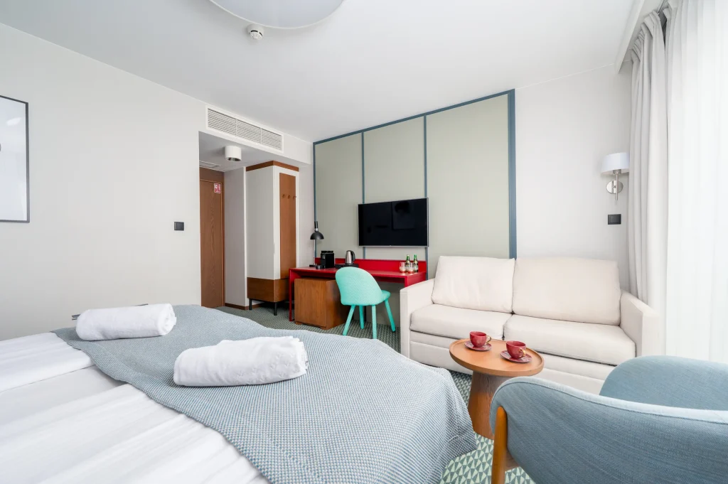 Sofa, bed and desk in a family room