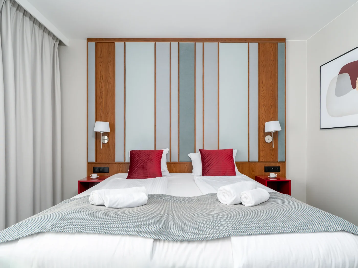 Bed headboard with wooden slats and wall lights