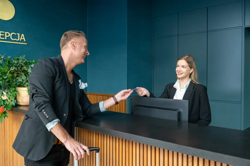 A room key card being handed over at reception